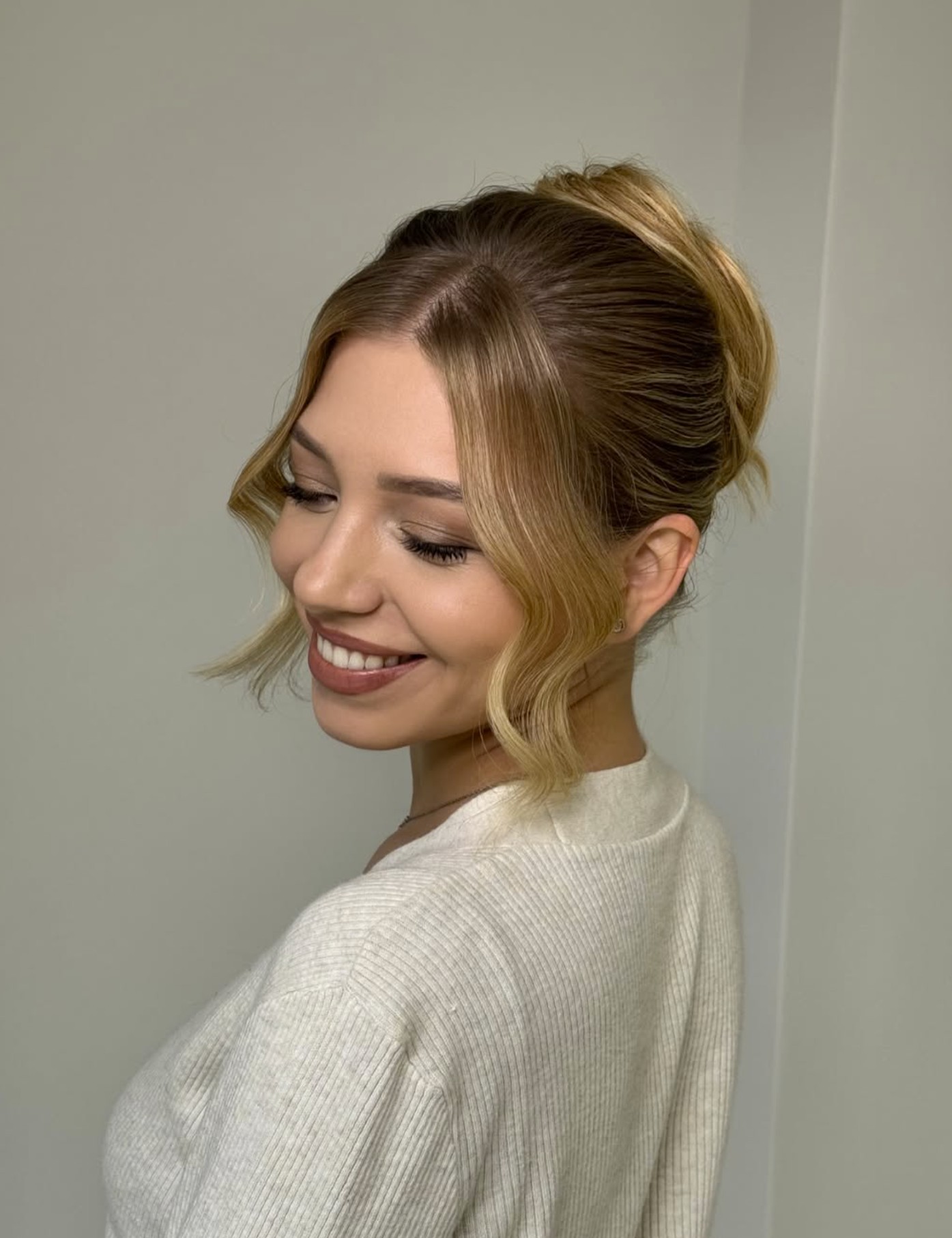 Behind the scenes — Jenneta perfecting a client's look in the studio